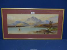A framed and mounted Watercolour depicting sailing boats on a calm loch with rugged mountains in