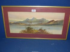 A framed and mounted Watercolour depicting sailing boats on a loch with two figures on the bank and