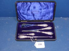 A cased set of Silver handled ladies items, including glove stretchers, shoe horn and button hooks,