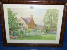 A framed Watercolour depicting Harrington House, Bourton-on-Water, signed lower right A.W.