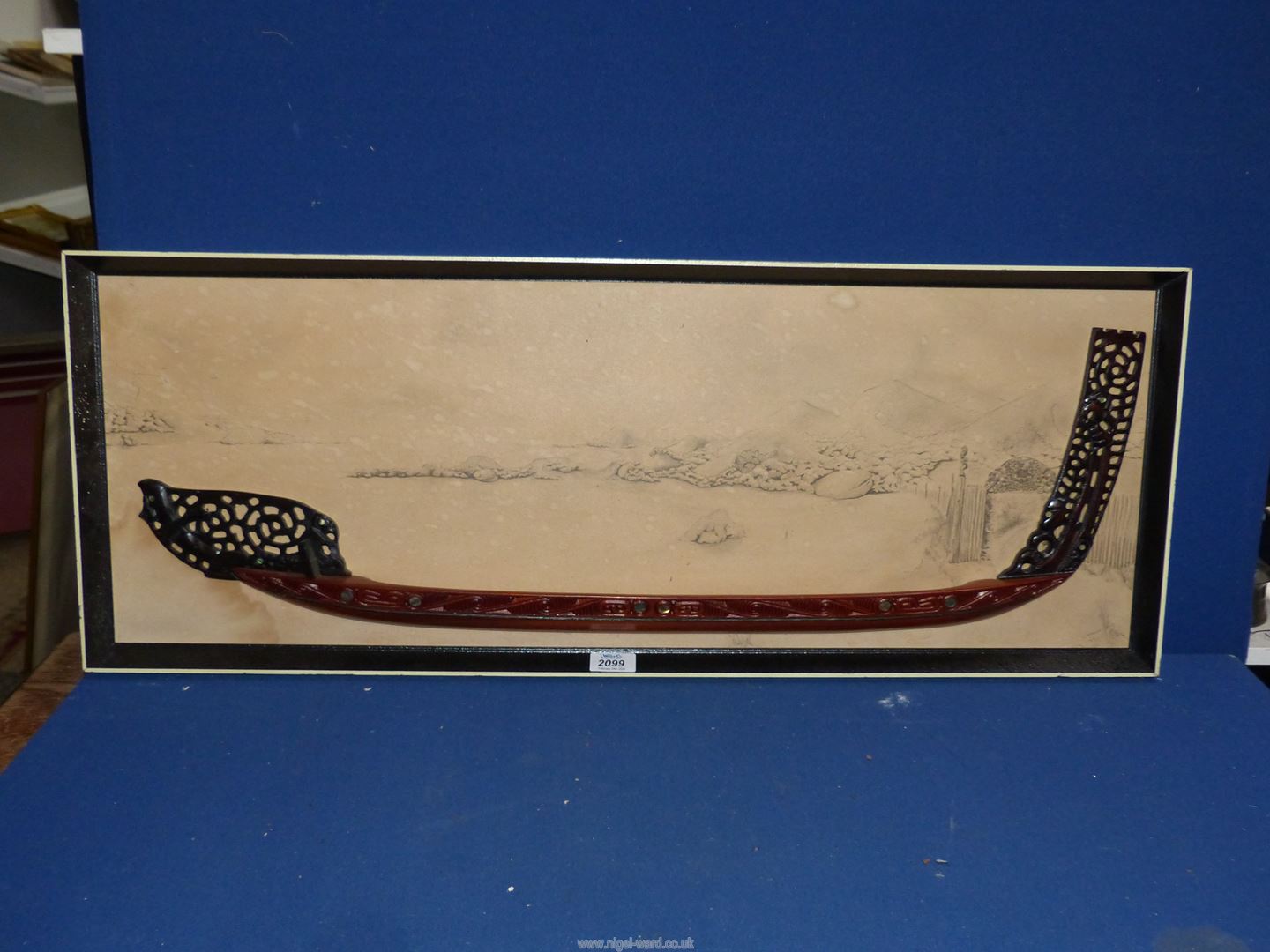 A half model Maori War Canoe against printed background, 90cm x 34cm.