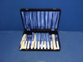 A cased set of fish knives and forks.