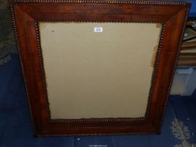 A large ornate picture frame, 31" x 32".