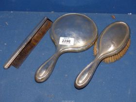 A sterling Silver Hand mirror and brush with engine turn detail to back, plus an unmarked comb, a/f.