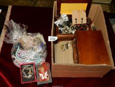 A quantity of costume jewellery including beaded necklaces etc plus two wooden jewellery boxes.