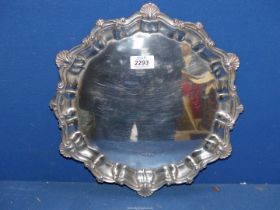 A Silver Salver with shell and scalloped edge, Sheffield 1973, makers M.T., 13" diameter, 952 grams.