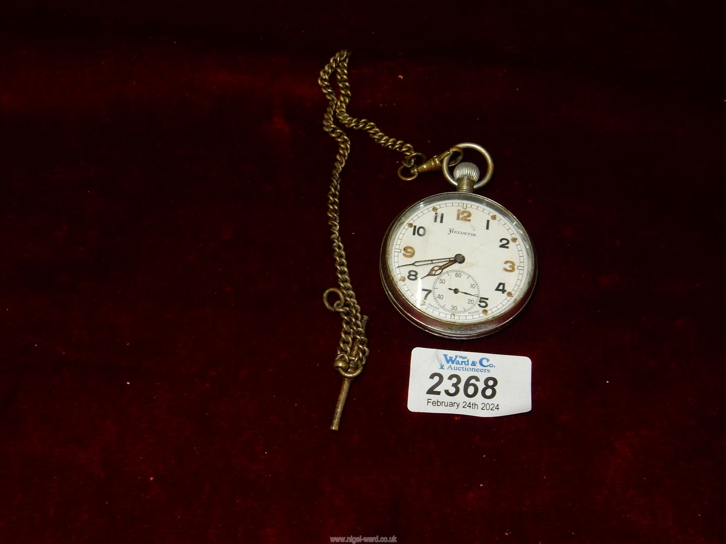 A Helvetia military issue Pocket watch (worn condition).