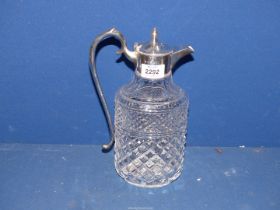 A cut glass Claret Jug with London silver lid and handle, dated 1977, maker Garrard & Co,