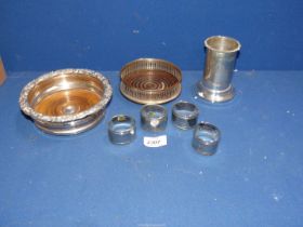 A small quantity of silver plate including; two bottle coasters, napkin rings and a spill vase/pot.