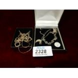 Four 925 silver necklaces including; one with a moon pendant, floral and square, etc.