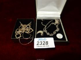 Four 925 silver necklaces including; one with a moon pendant, floral and square, etc.
