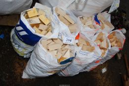 Eight small bags of softwood off cuts.