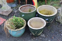 Four glazed planters, from 11 1/2'' to 15'' diameter and 9'' to 14'' in height.