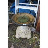 Concrete bird bath with sundial, 16'' high x 14'' diameter.