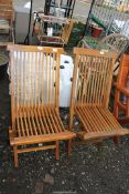 Pair of teak folding garden chairs.