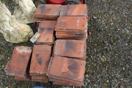 Quantity of old terracotta "Perfecta" roof tiles.