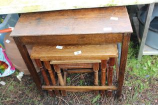 Nest of three oak tables, plus an occasional table.