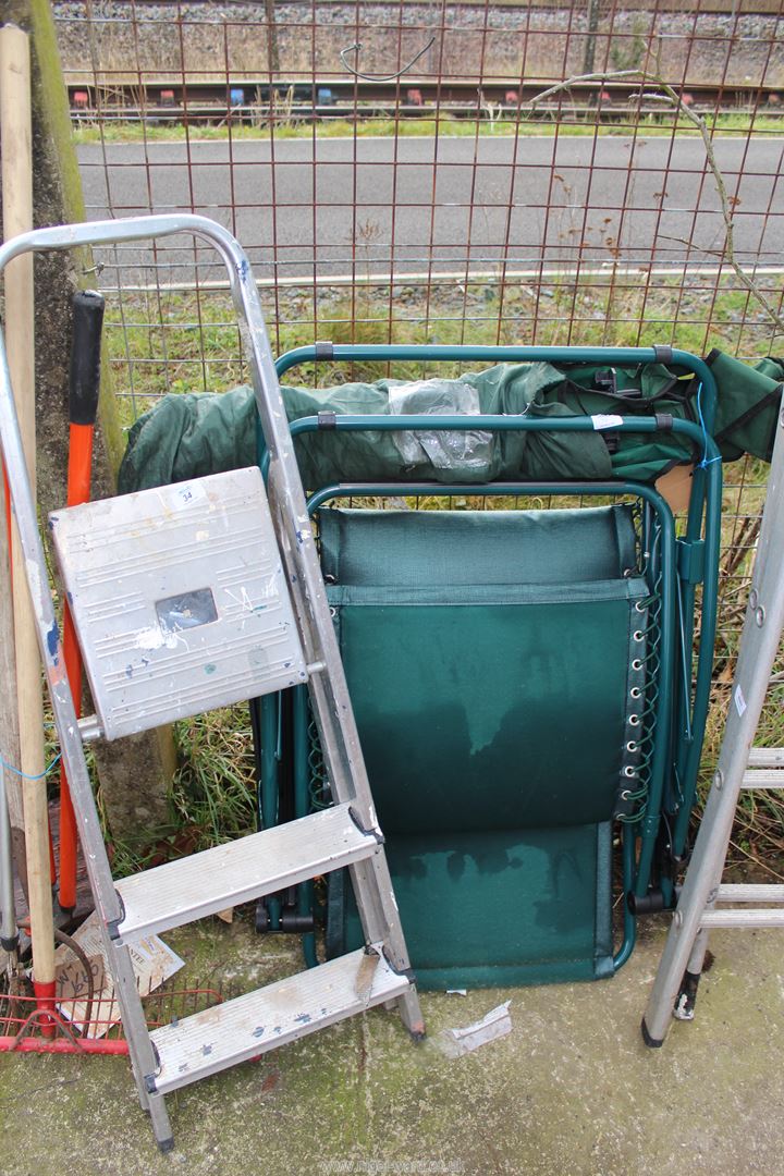 Three rung stepladder and fishing chairs.