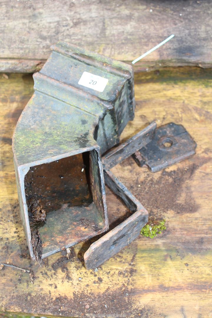 Cast iron drain spout, 5'', with brackets.