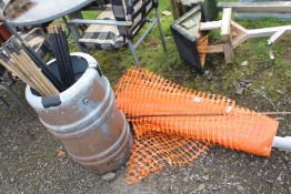 Roll of orange fencing with metal stay, plus water tub and drain rods.