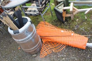 Roll of orange fencing with metal stay, plus water tub and drain rods.