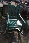 Large green painted rocking chair, possibly teak.