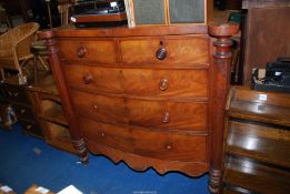 A mahogany bow front chest of drawers, two over three.