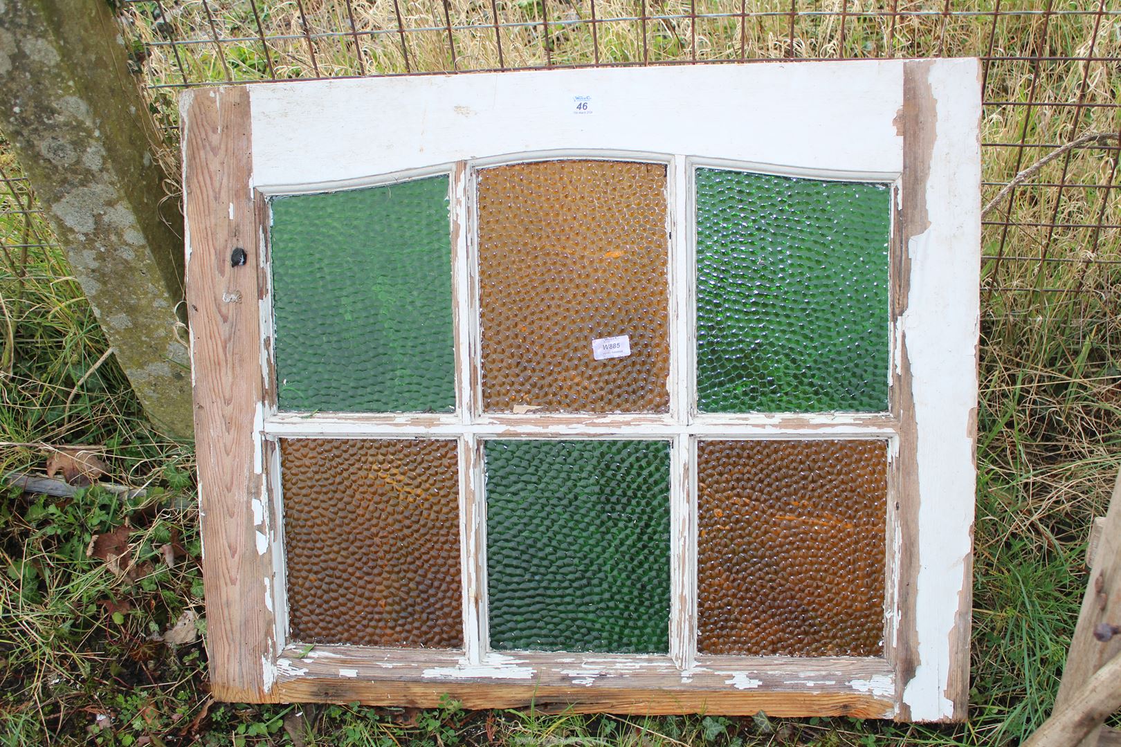 Stained glass window casing, 33'' x 27''.