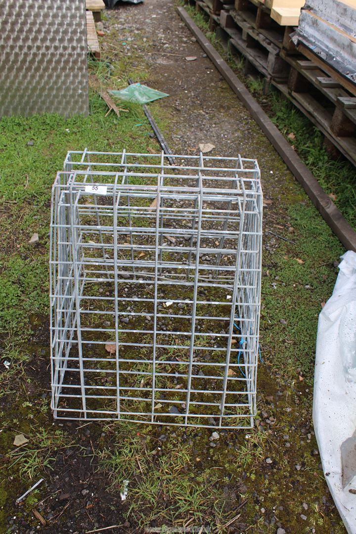 Two "over-hurdle" hay racks.