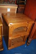 A Pine bedside table with shelf.