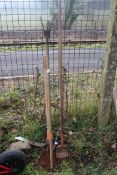 Grass hook, pick axe and hand cultivators.