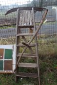 Scythe and six rung wooden stepladder.