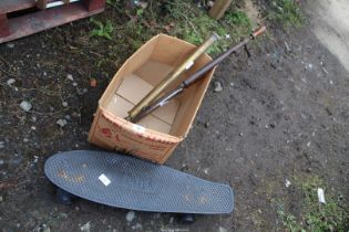 Skate board and vintage garden sprayer pumps.