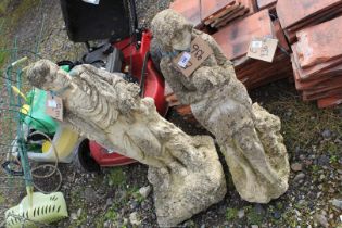 Two concrete figures of lady holding a lamb, 30" high and a gent, 32'' high.