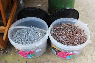 Two tubs of assorted nails.