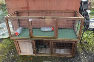 Two rabbit hutches/runs.