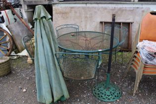 Patio table 42'' diameter x 28 1/2'' high with four chairs and parasol base.