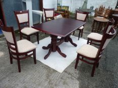 A Darkwood Dining table, 59" x 36" x 29" high and six upholstered dining chairs.