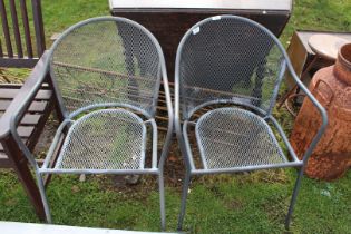 Two metal garden chairs.