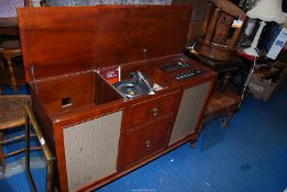 A "Dynatron" radiogram having a "Garrard" deck, not working at time of lotting.