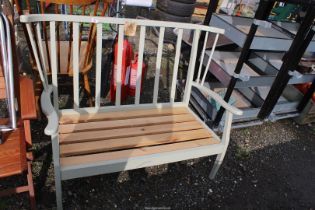 Painted settee frame, 43'' wide x 34'' high and kitchen chair with decoupage cartoons to seat.