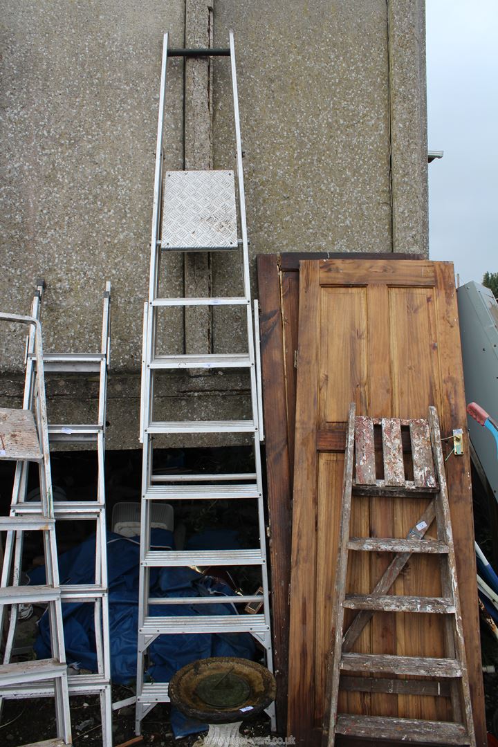 Eight run aluminium ladder.