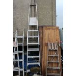 Eight run aluminium ladder.