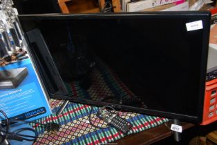 A LG flat screen 27" TV with remote.