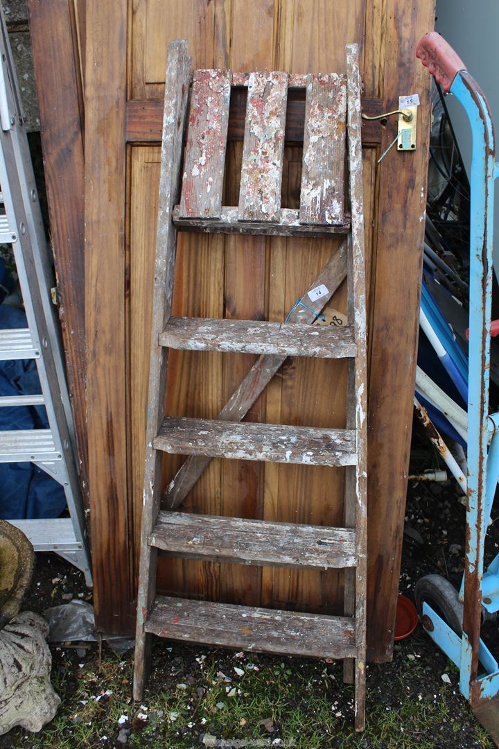 Five rung wooden step ladder.