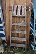 Five rung wooden step ladder.
