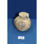 An ancient Corinthian aryballos, 6th century BC, for restoration; broken with an area of loss,