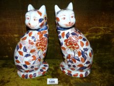 A pair of Imari cats, 10" tall (hairline crack to one).