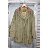 A Gents outdoor Tweed coat by Grenfell in olive green with red, black and mustard check,