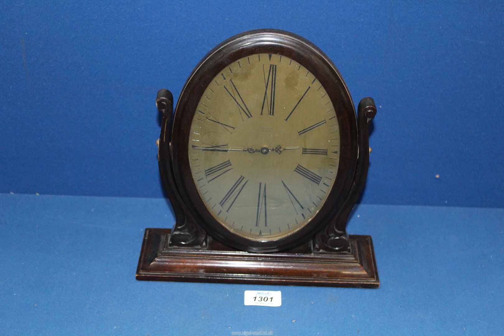 A Waltham's oval swing Clock.